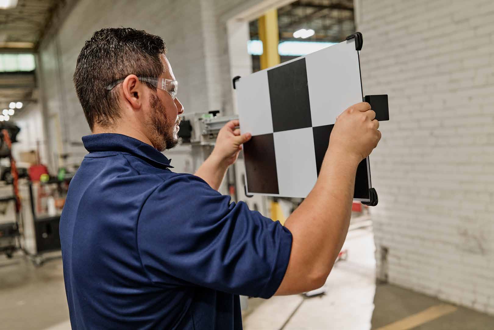 Protech technician diagnosing a vehicle